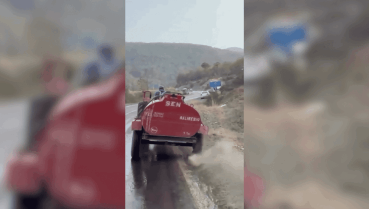 Bursa'da bir çiftçi, patlayan lastiğe rağmen yangına su taşıdı