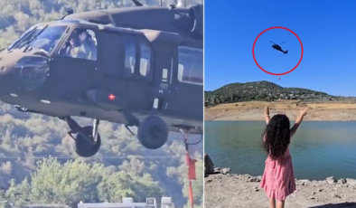 Hatay'da yangın söndürme helikopterinin pilotu ve küçük kız arasında yürek ısıtan görüntü