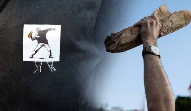 Direnişin yeni sembolü: Banksy'nin "Çiçek Fırlatan Adam"ı "Sandviç Adam"a dönüştü! Protesto gösterilerinde artık sandviç tutuyorlar